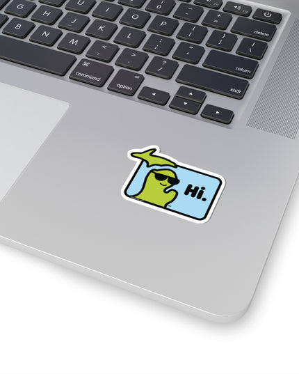 Small sticker with Michigan character with sunglasses waving and saying "Hi" on a laptop.