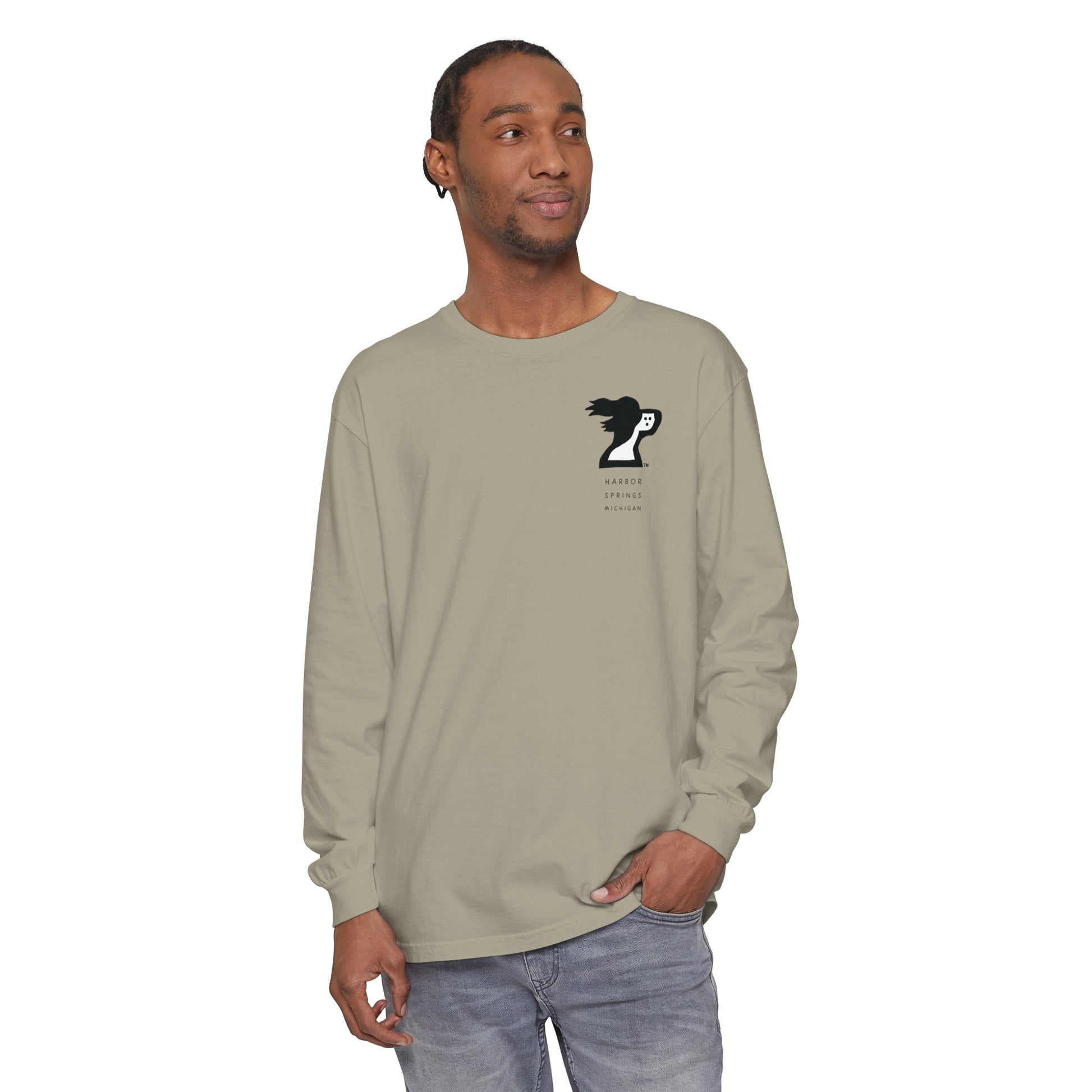 Man wearing a tan color long sleeve t-shirt by the Harbor Springer brand with a springer spaniel dog logo and Harbor Springs Michigan text.