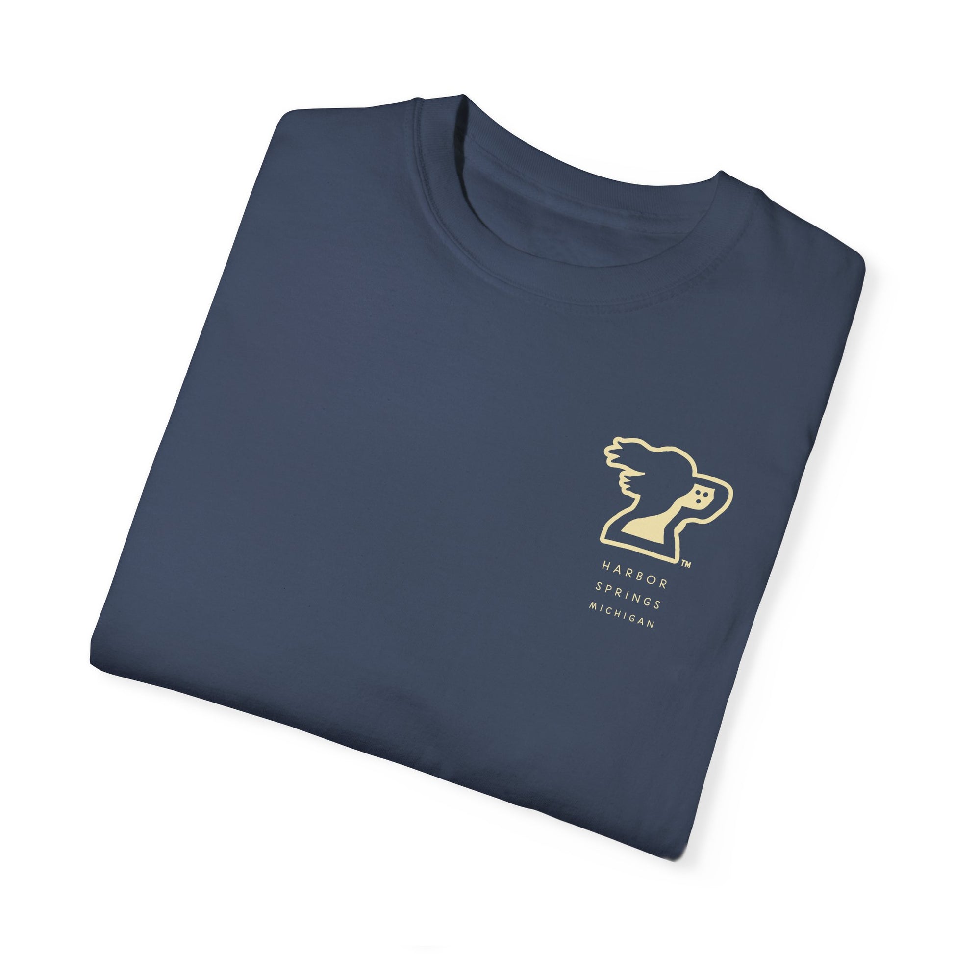 Folded dark blue color t-shirt by the Harbor Springer brand with a springer spaniel dog logo and Harbor Springs Michigan text.