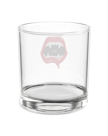 Burp Fangs tempered rocks glass, lifestyle shot — funny Halloween barware gift