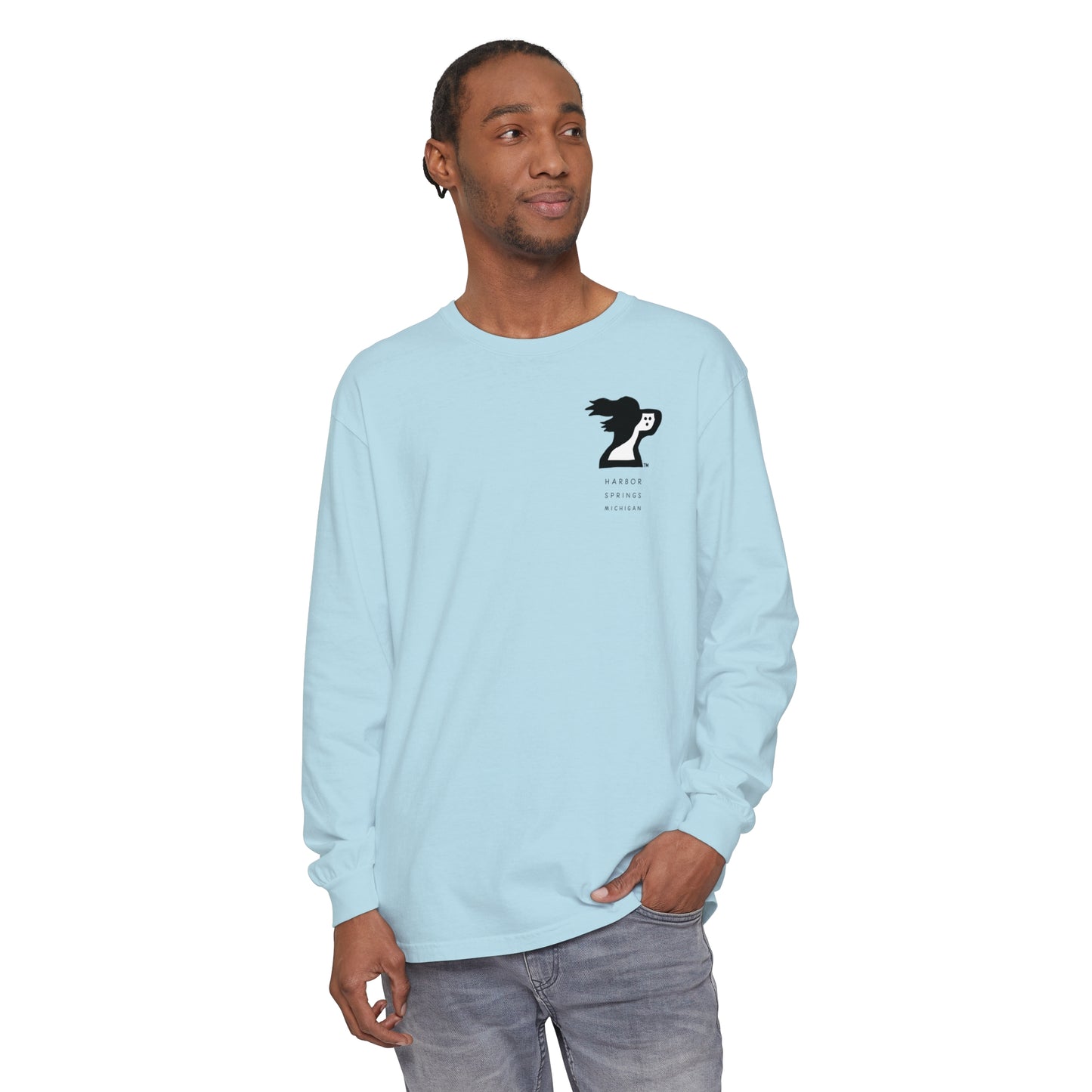 Man wearing a light blue long sleeve t-shirt by the Harbor Springer brand with a springer spaniel dog logo and Harbor Springs Michigan text.