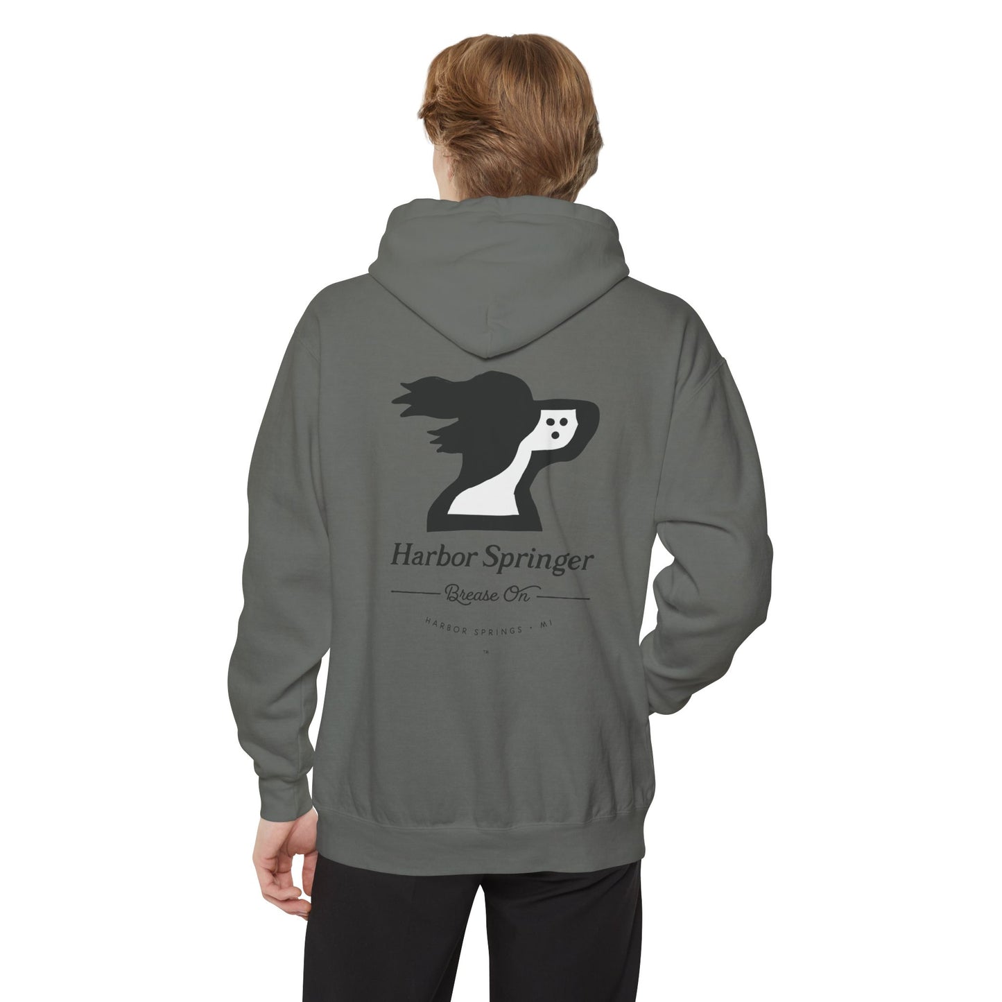 Man wearing a gray hoodie by the Harbor Springer brand with a springer spaniel dog logo and Brease On tagline on the back.