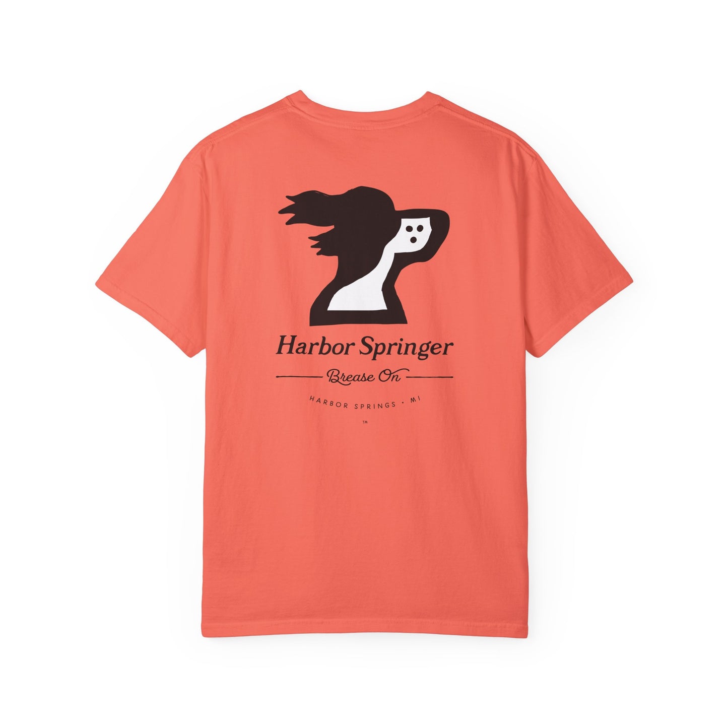 Salmon color t-shirt by the Harbor Springer brand with a springer spaniel dog logo and Brease On tagline on the back.