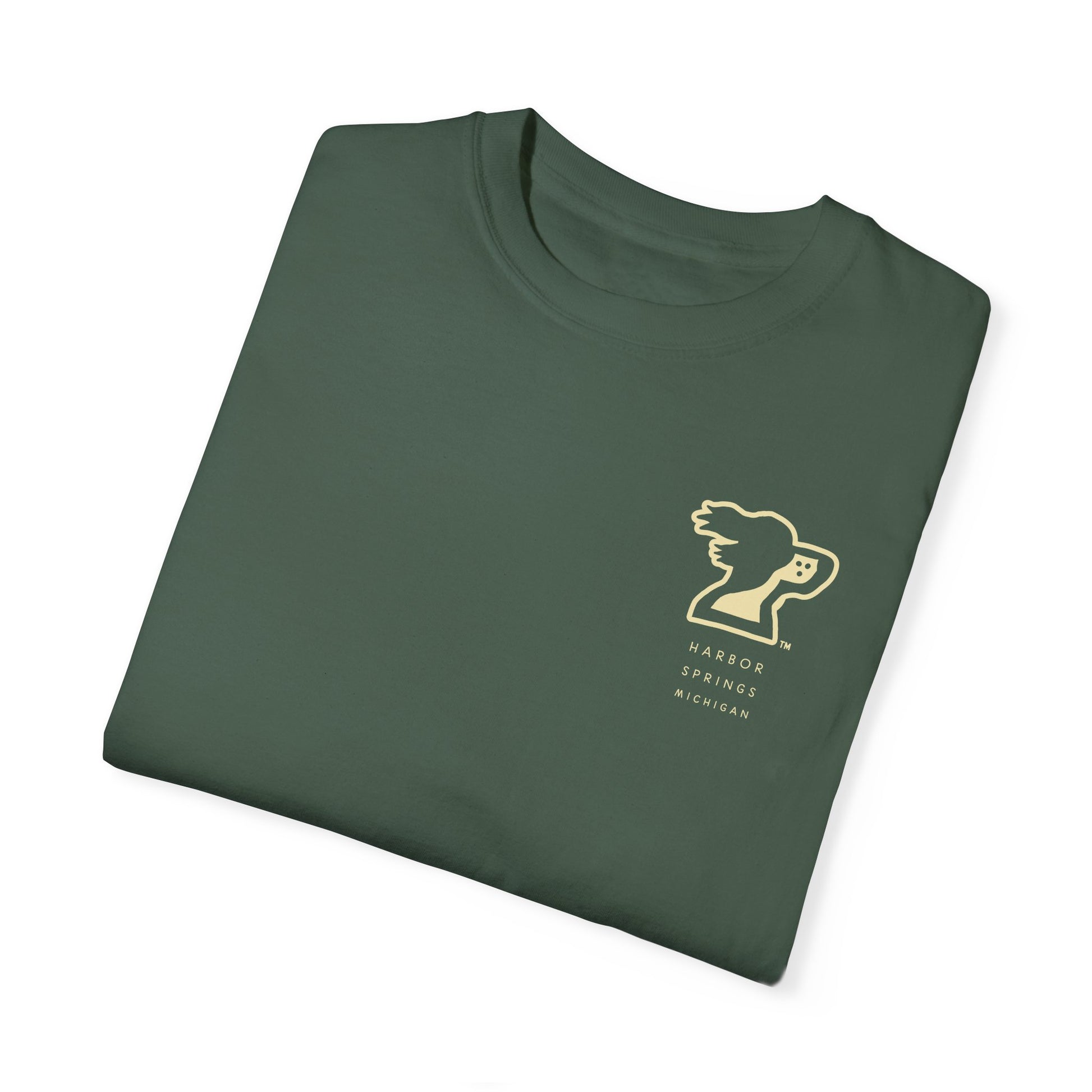 Folded forest green color t-shirt by the Harbor Springer brand with a springer spaniel dog logo and Harbor Springs Michigan text.